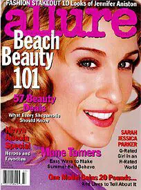 A magazine cover with a woman smiling for the camera.