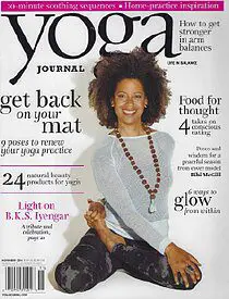A woman is sitting on the cover of a magazine.